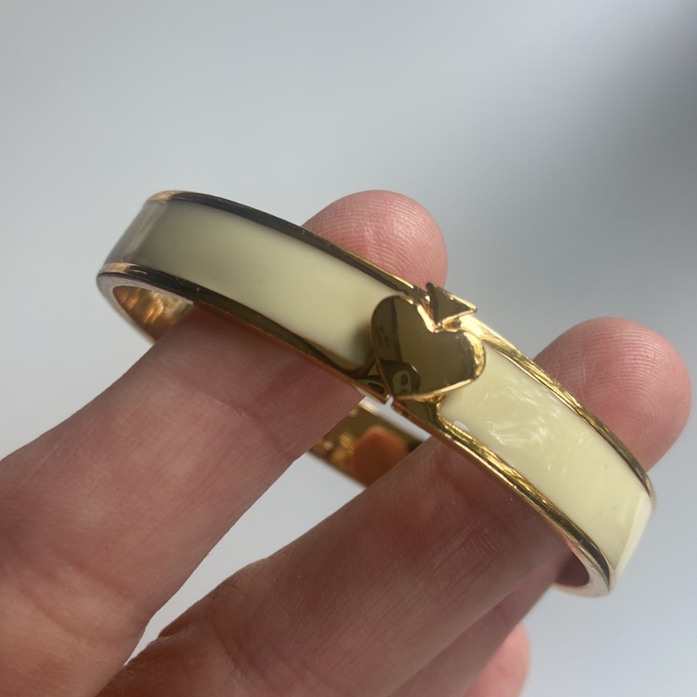 Kate Spade ivory bangle with spade adornment